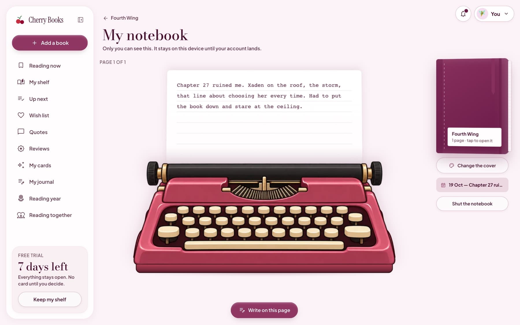 The book notebook: a pink typewriter with a typed page about Fourth Wing